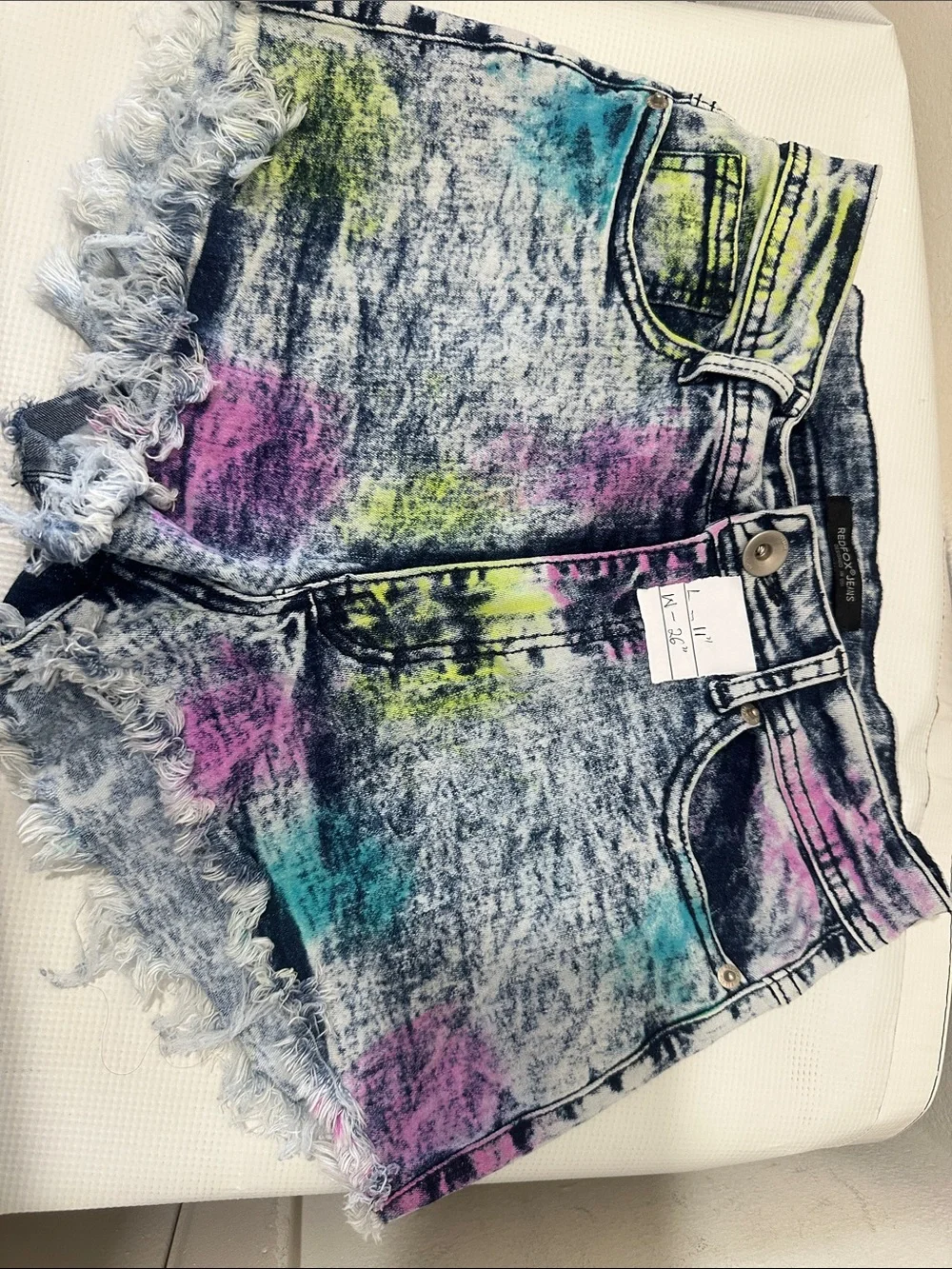 High-Rise Acid-Wash Denim Cutoff Shorts in Multicolor Splatter